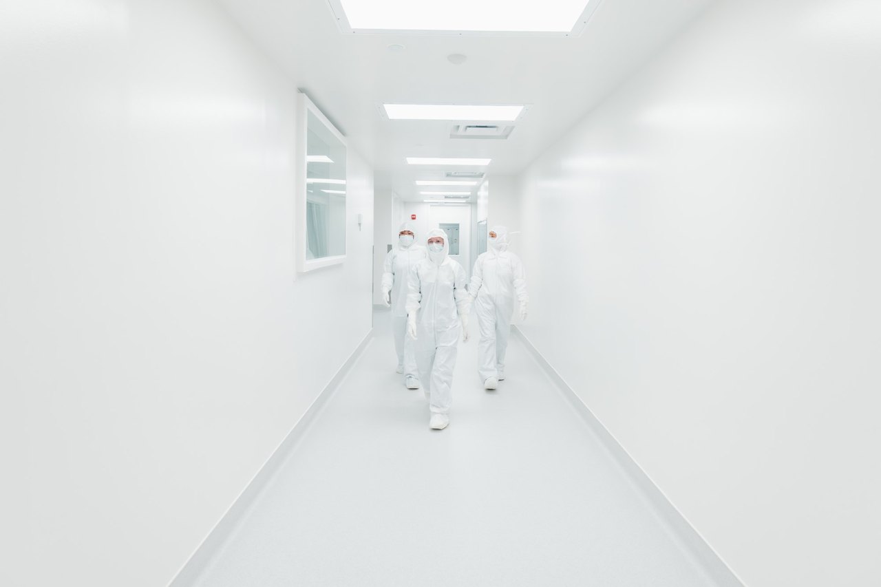 Made Scientific staff in a Princeton GMP cleanroom corridor